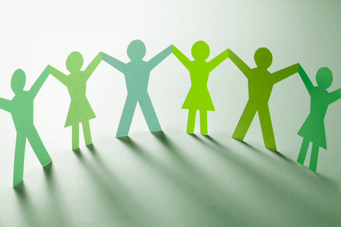 Green paper chain people holding hands